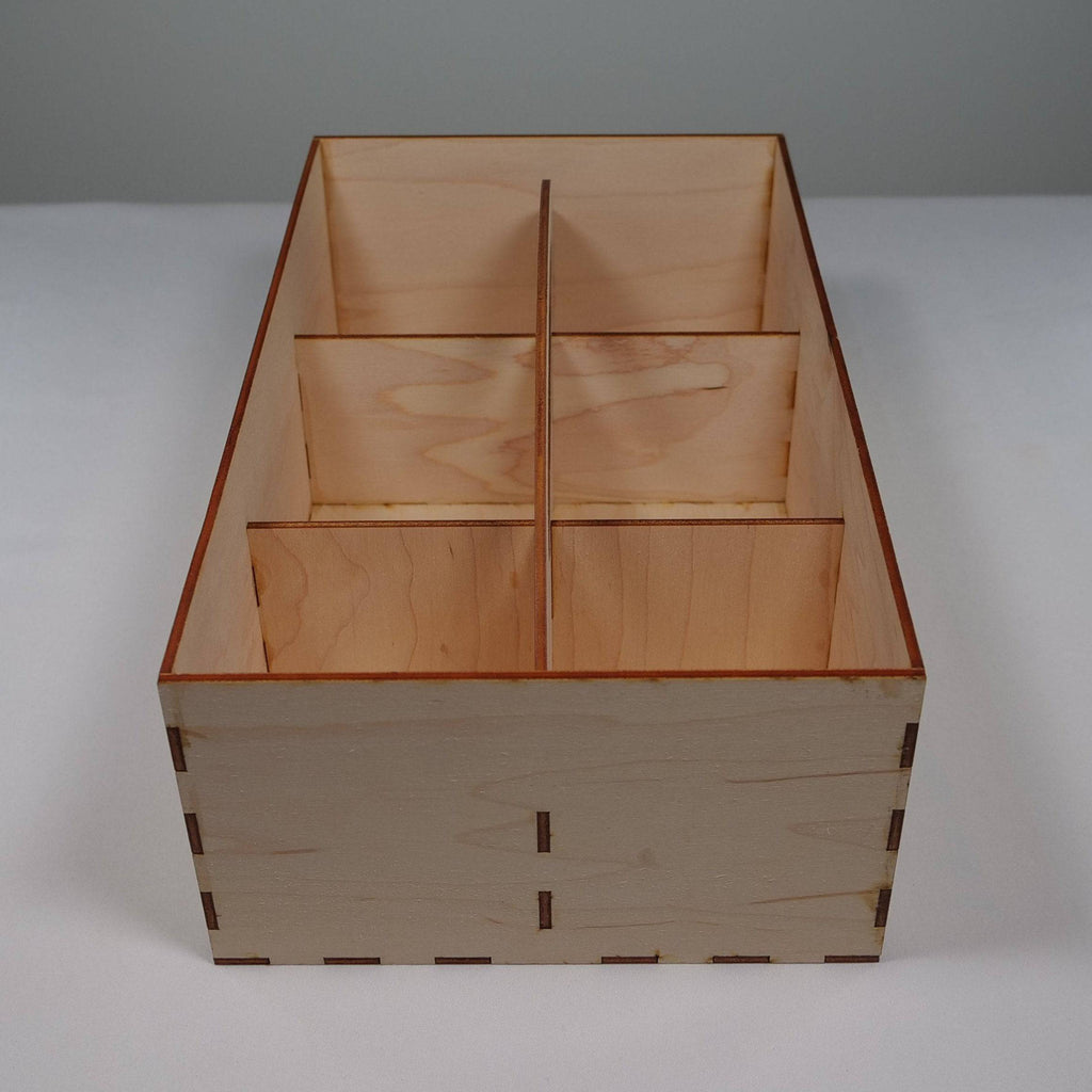 Curious Rabbit garden seedbox with handle in flatpack model kit, suitable for organizing and storing garden seeds.