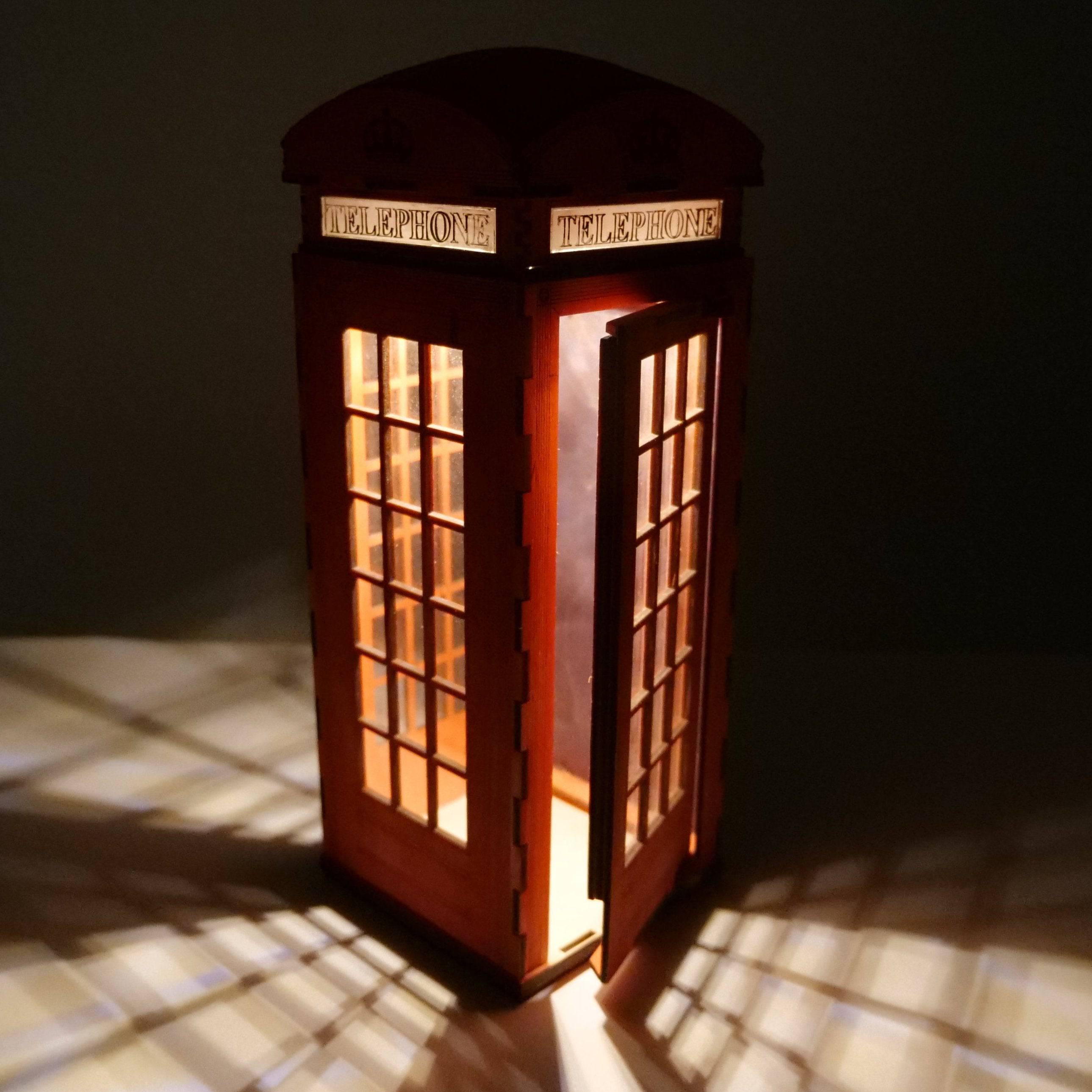 Curious Rabbit Telephone Box Lamp icon flatpack model kit, detailed miniature lamp with classic phone booth design.