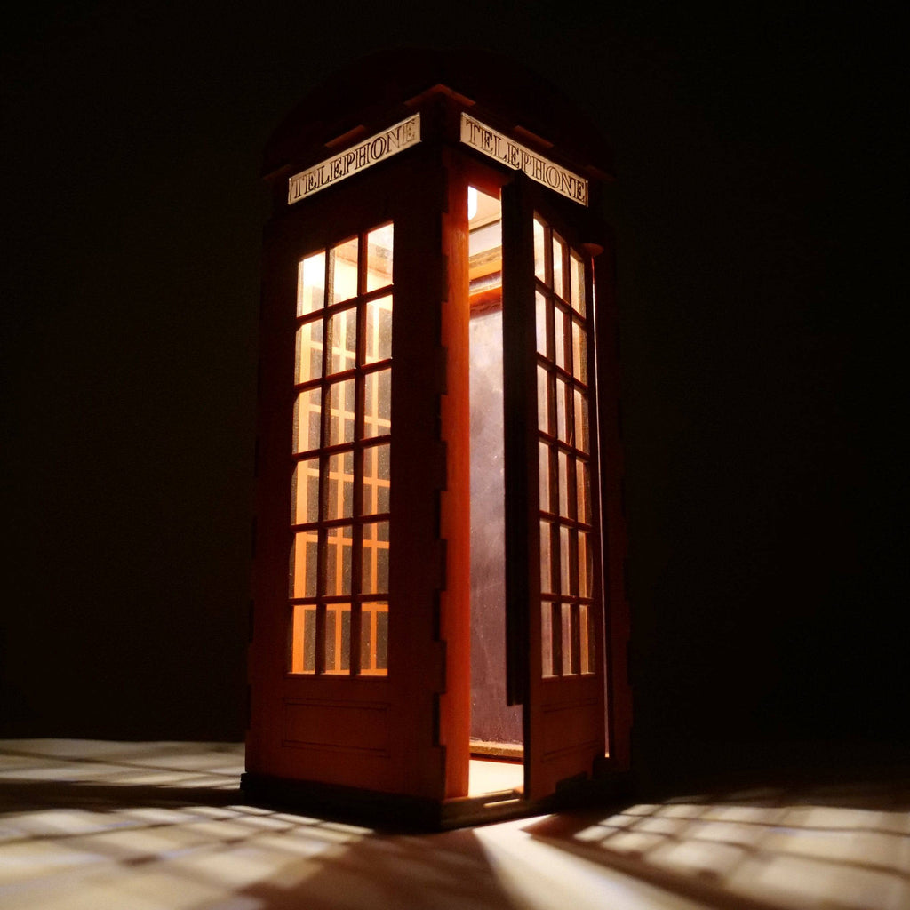 Curious Rabbit Telephone Box Lamp flatpack model kit with icons, featuring a detailed red telephone box design for assembly.