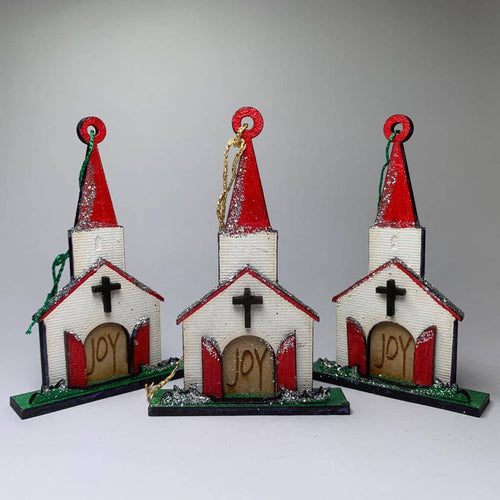 Handmade Curious Rabbit Church Joy Bauble Christmas ornament hanging on a festive tree branch.