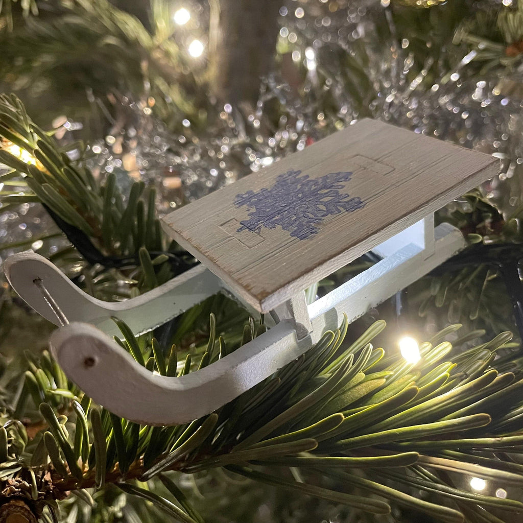 Rustic handmade Christmas winter sledge bauble ornament by Curious Rabbit, festive holiday decoration with seasonal charm.