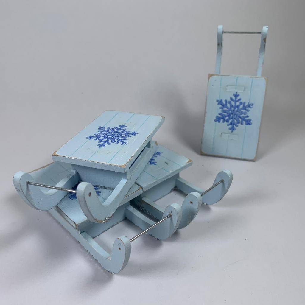 Rustic handmade Christmas winter sledge bauble by Curious Rabbit, decorative holiday ornament with winter festive details.