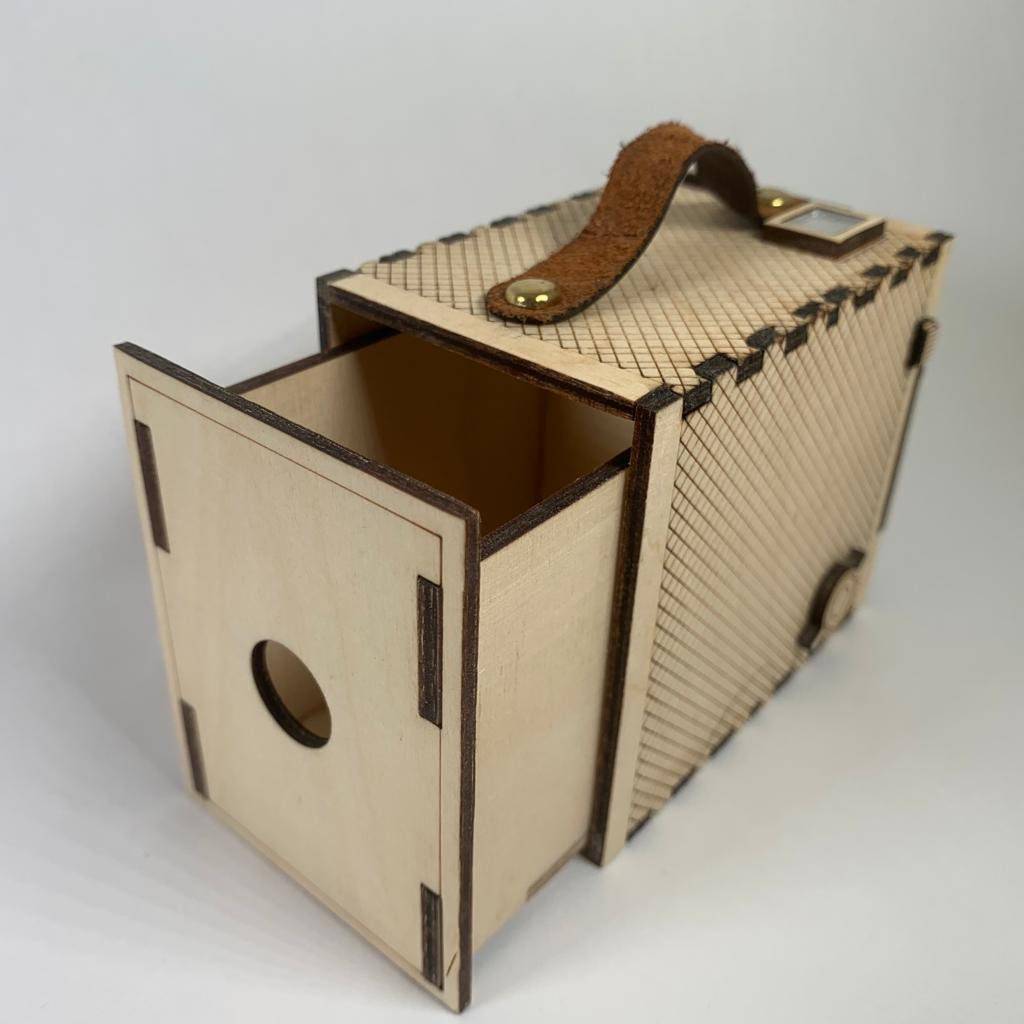 Vintage Brownie Camera flatpack model kit by Curious Rabbit, showing assembled and unassembled parts of the retro camera.