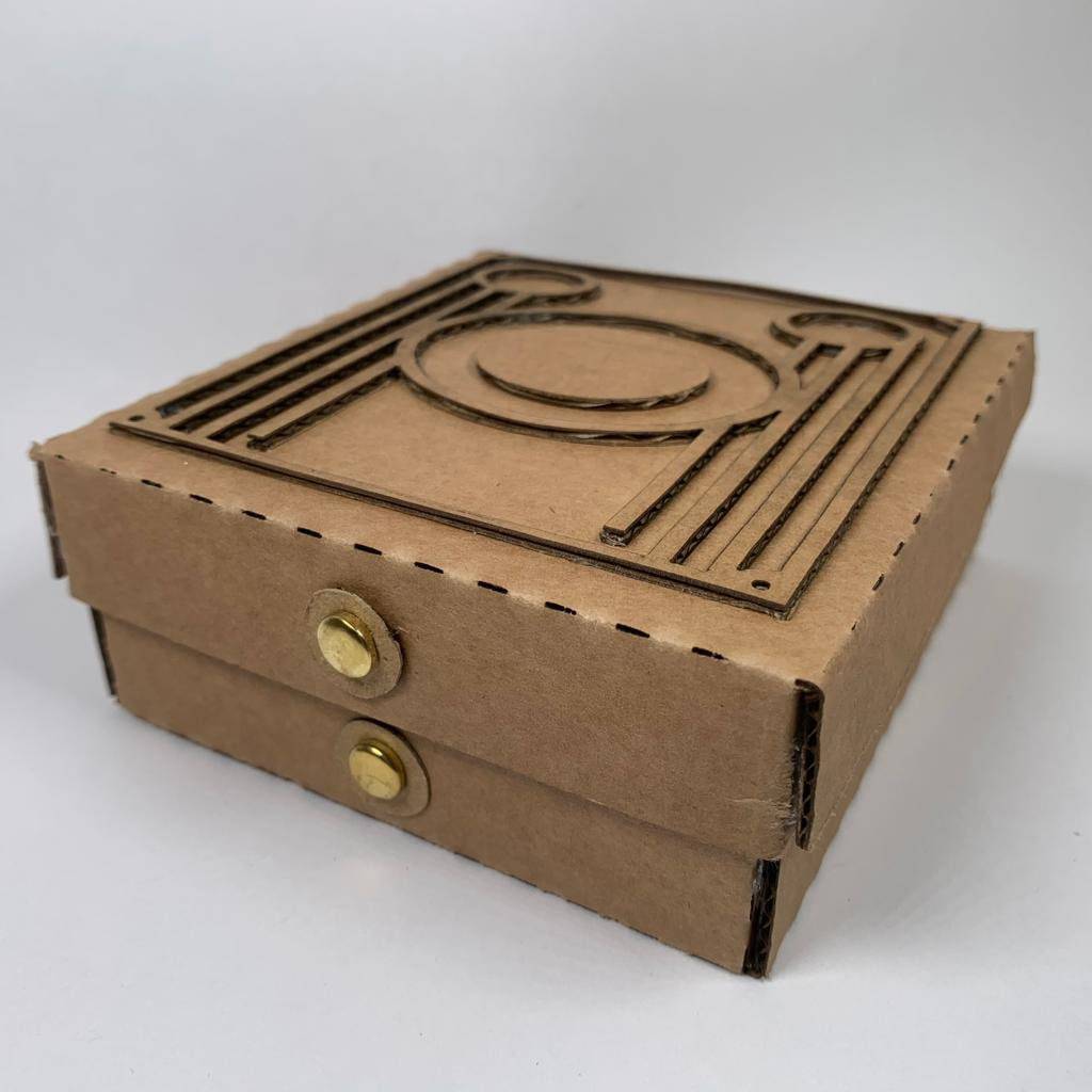 Vintage Brownie Camera flatpack model kit by Curious Rabbit, showing assembled wooden camera with detailed parts and classic design.